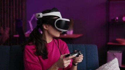 Female playing online video games - Happy gamer having fun with new technology console with virtual reality experience - Youth millennial lifestyle and technology concept.