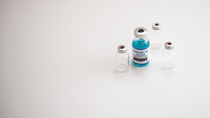 vaccine for vaccination against covid-19, vaccine bottle, syringe, isolate background, copy space, web banner.