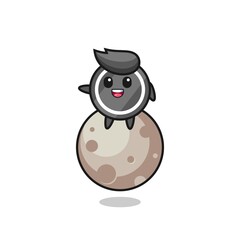 illustration of hockey puck cartoon sitting on the moon