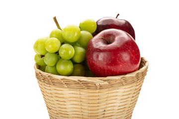 Fresh fruit basket on white background.