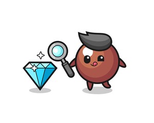 chocolate ball mascot is checking the authenticity of a diamond