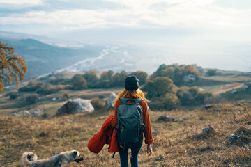 Fototapeta premium woman hiker travel mountains landscape autumn trees