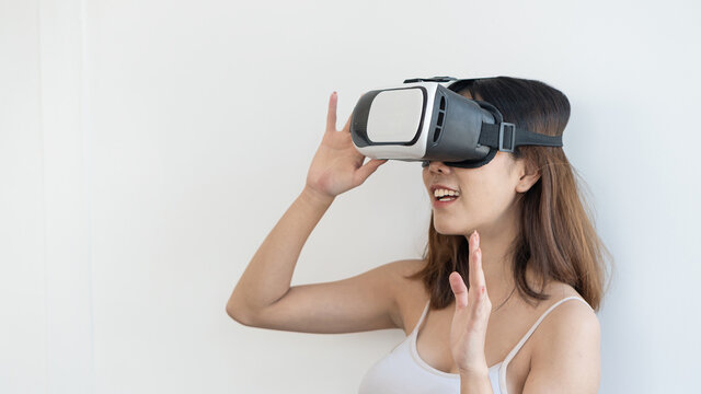 girl with virtual reality glasses to watch movies alone on white background headset