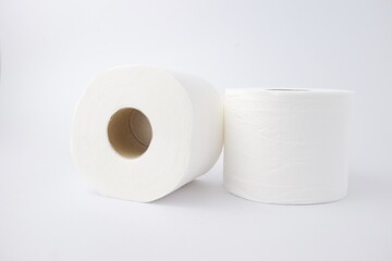 Close-up of toilet paper rolls, tissue paper, household products isolated on white background