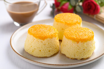 Thai gold egg yolk thread chiffon cake on plate and coffee
