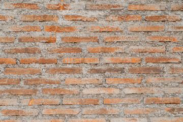 Naklejka premium Wall background, red brick with cement texture