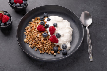 Healthy breakfast with baked granola and greek yogurt.