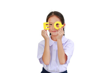 Asian little young girl child in school uniform holding alphabet EQ (Emotional Quotient) text on...