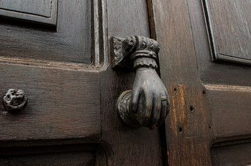old wooden door with lock and knocker