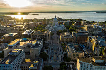 Aerial view of main street in Madison, Wisconsin. Capitol building as city dominant with sun as background - 437153750