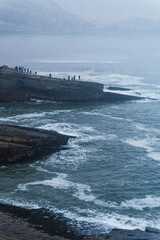 The friar's jump, famous cliff in Chorrillos Lima Peru, group huge rocks in the coast, waves hitting the rocks