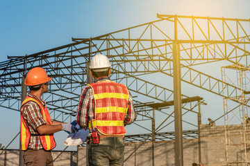 Engineers discussion with architects work planing in construction site