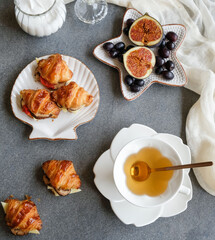 Light snacks for between meals / Mini Croissant and Tea / It goes well with mushrooms and cheese  fillings. Fresh fruits like figs and black grapes as sweet treats