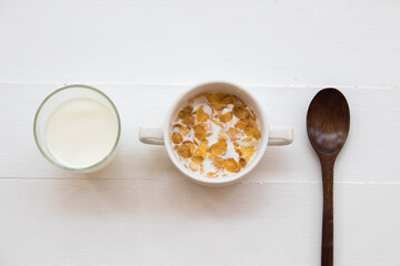 mix corn flakes, milk healthy foods for children eats and healthy drinks fresh milks in breakfast decoration flat lay style on background wooden white