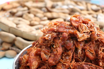 Close up details of ripe sour brown tamarind pile peeled tamarind seeds for make soggy tamarind