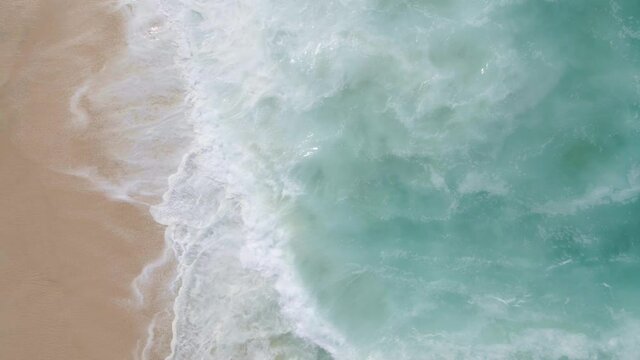 aerial drone shot of the waves in the ocean