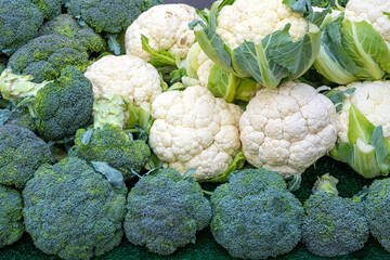 Broccoli and cauliflower for sale at a market