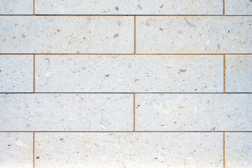 Background from a wall with rectangular granite stone slabs