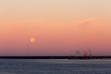 sunrise over the bay with the moon