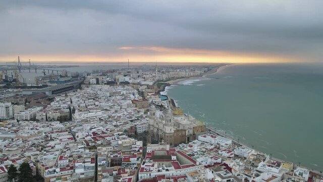 The city of Cadiz and the Modern Port Constitution Of 1812 Bridge also known as La Pepa Bridge in the background. Aerial View