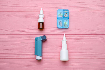 Composition with inhaler on color wooden background