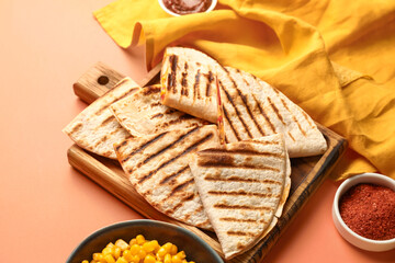 Board with tasty quesadillas, corn, spices and sauce on color background, closeup