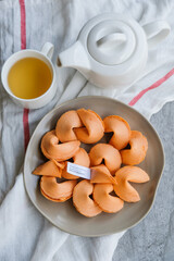 Enjoying snacks with fortune reading / Fortune Cookies / Good and meaningful phrases and proverbs or even printed lucky numbers for lottery