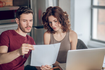 Two people working on project and looking busy