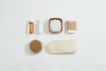 Spa still life background. Set for body care. Bottles with gel and shampoo, soap, sea salt, washcloth for bath.