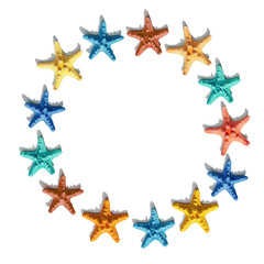 Fototapeta na wymiar Round frame from colorful with colorful sea stars. Happy, bright and summer mood flat lay.