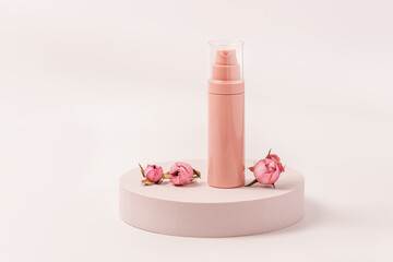 Aroma beauty cream container with essential oil flower of rose on round podium. Cosmetic product, pink pastel colored