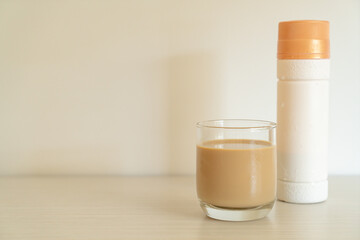coffee latte glass with ready to drink coffee bottles