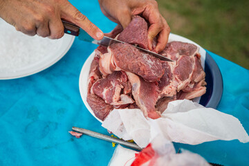 butcher cutting meat