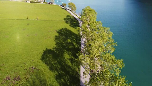 Promenade for bikers and pedestrians by beautiful Achen lake in Austria mountains, Tyrol. Bikelane surrounded by amazing nature in Alps.
