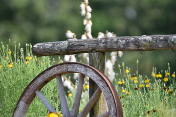 old wooden wheel hitching post