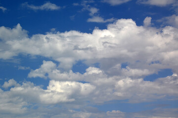 fluffy clouds and clouds in the blue sky
