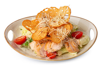 Caesar salad with grilled chicken on white wooden background