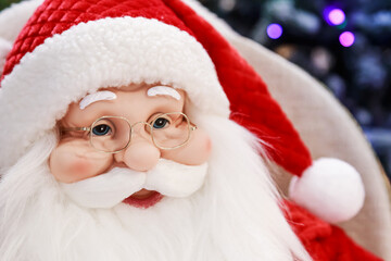 Portrait of santa claus head with glasses and face with beard toy christmas festive doll close up