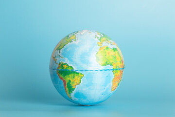 Globe of the Earth on a blue background. Ecology, globalization, environment concept.