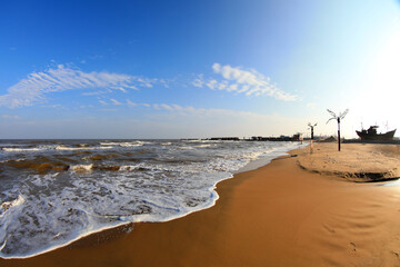 Beach scenery under blue sky and white clouds, North China