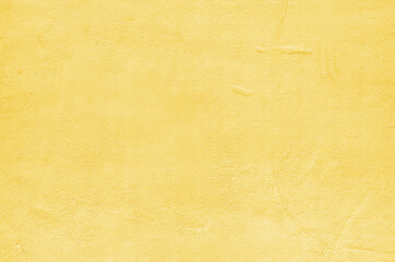 Abstract yellow cement plaster wall texture background 