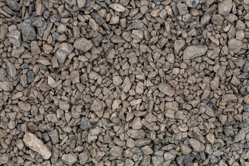 brick rubble debris on construction site. inorganic crushed stone, non-round, loose material with...