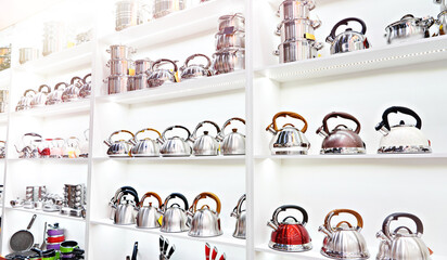 Metal stainless steel pots and teapots in store