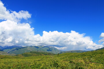 landscape with clouds over the mountains