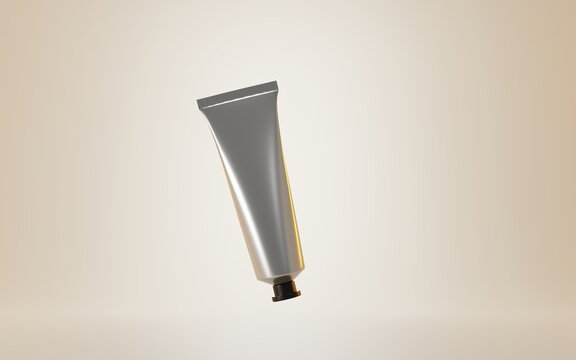 Metal tube hand cream or toothpaste. Make up cosmetic product package ad on isolated beige background. Aluminium or silver blank container with black cap, realistic 3d illustration mock up banner