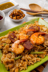 Kwetiau goreng medan or char kway teow It is made from noodles, which are stir fried in cooking oil with garlic, onion or shallots, pork, fried prawn, sliced bakso (meatballs) 
