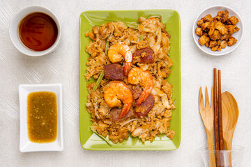 Kwetiau goreng medan or char kway teow It is made from noodles, which are stir fried in cooking oil with garlic, onion or shallots, pork, fried prawn, sliced bakso (meatballs) 