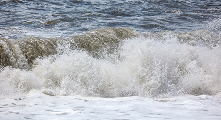 Splashing big waves on the seashore.