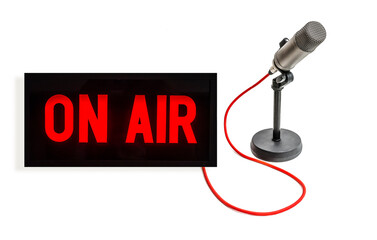 Professional microphone in radio station studio and on air sign