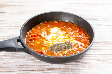 Tomatoes and spices in a pan. Chicken kadhai. Indian chicken curry. Cooking step by step